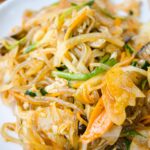 Appetizing stir-fried noodles with vegetables on a plate, perfect for a delicious meal idea.